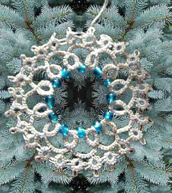 biało zlota gwiazdka z jasno niebieskimi koralikami